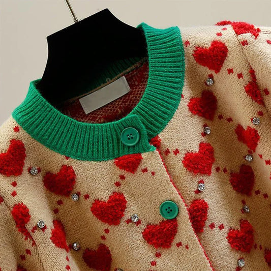 Heartfelt Knit: Cozy Cardigan with Playful Pom-Pom Details