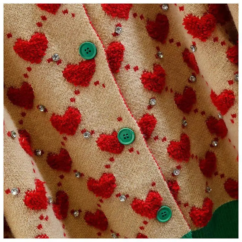 Heartfelt Knit: Cozy Cardigan with Playful Pom-Pom Details
